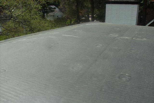 The finished flat roof easily hides all of the work that goes into installing it, but it is important to realize all of the work that goes into installing what you can't see.