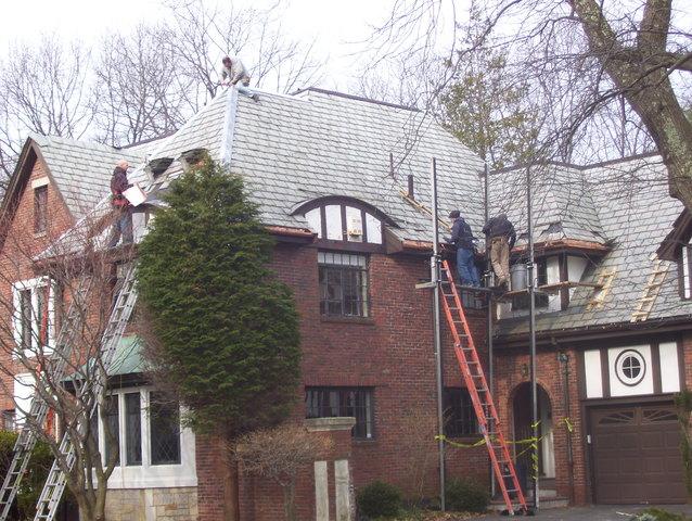 Our crew stages the job properly, making sure they're safe and ready to start the project. Restoring beautiful slate roofs like this one in Brookline is the type of project our crew prides themselves on.