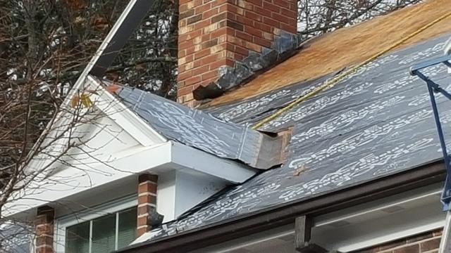 This picture shows how the ice & water shield is wrapped up and around the dormer as well, effectively tying it into the rest of the roof system and protecting the area from leaks and ice damage.