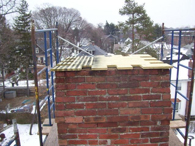 The first step of sealing off this chimney is the layer of plywood which the copper chimney cap will be build around.