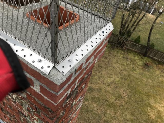 Re-pointed chimney with a brand new crown and stainless steel chimney cap