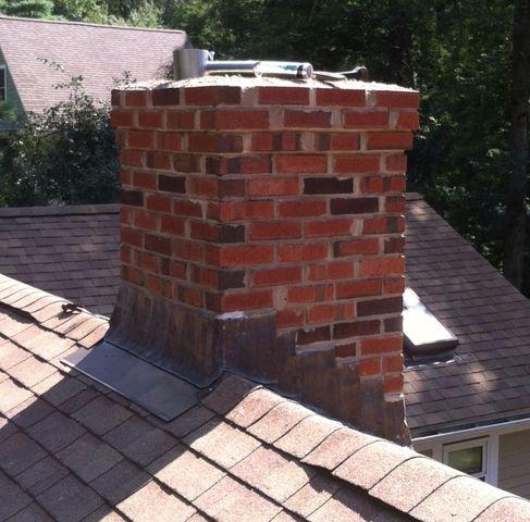 The courses have been rebuilt, leaving just the flashing and chimney cap before the project is completed.
