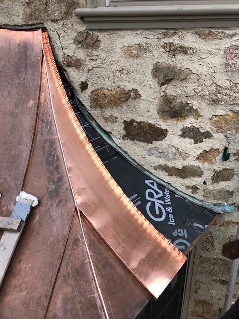 Installing the brand new, hand crafted copper dormer roof.

