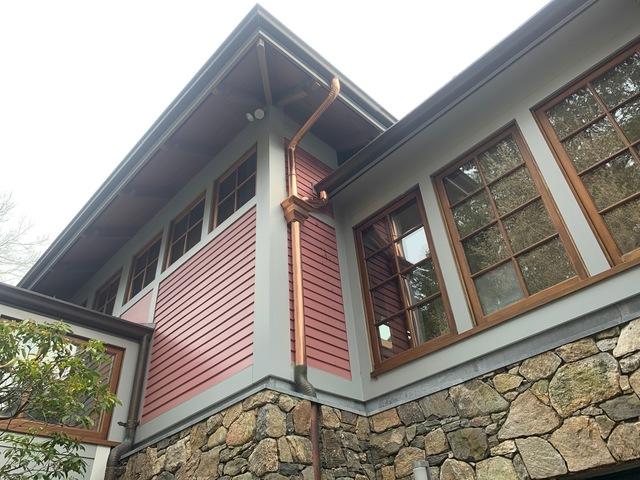 Installed copper downspouts.