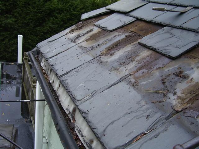 Began the process of removing old shingles to remove gutters and install ice and water shield.
