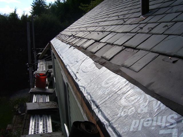 After removing slate shingles, we installed new ice and water shield.