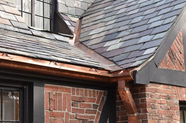 Copper gutter, downspout, and valley on slate roof.
