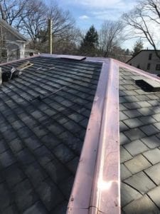 Ridge ventilation on a slate roof.