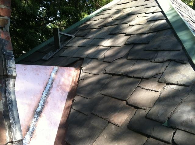 Copper roof looking beautiful on the slate roof.

