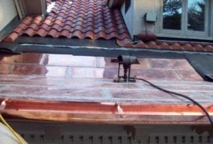 Copper flat roof installation by roofing contractors in Needham, Newton, Wellesley, Brookline.