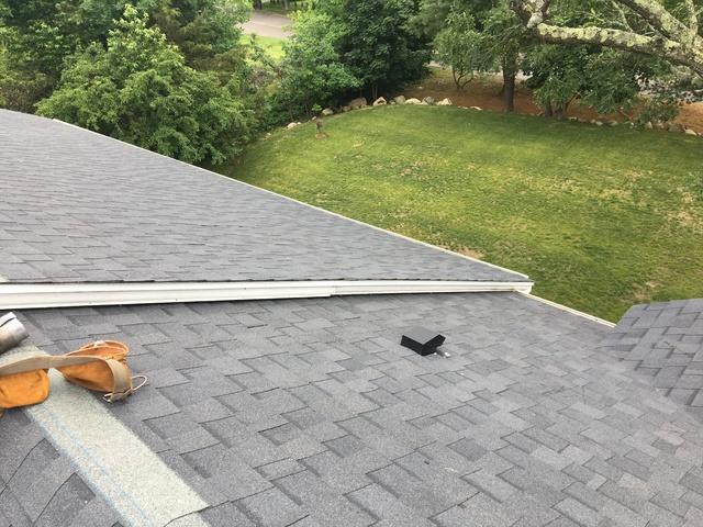 With this section of the roof properly protected, our crew finishes this area with crown molding.