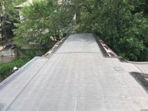 Rubber flat roofing installed by roofing contractor in Newton, Wellesley, and Brookline.