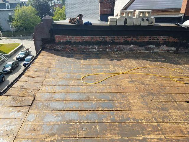The old roof has been completely removed and properly disposed of, so our crew can now move on to installing the new flat roof.