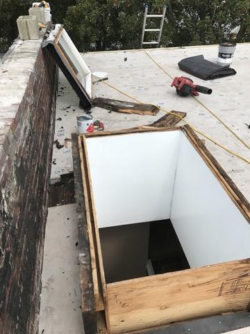 The roof and flashing kit are stripped back around the skylight, allowing us to repair the damaged wood surrounding the skylight. This ensures that the skylight will be water tight with the new roof.