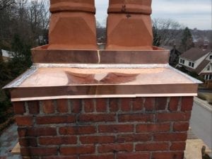 Copper chimney crown installed by roofing company in Needham, Newton, Brookline, and Wellesley.