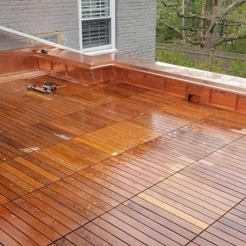 The deck has been completed, and these homeowners are now free to go outside and enjoy their beautiful new roof deck.