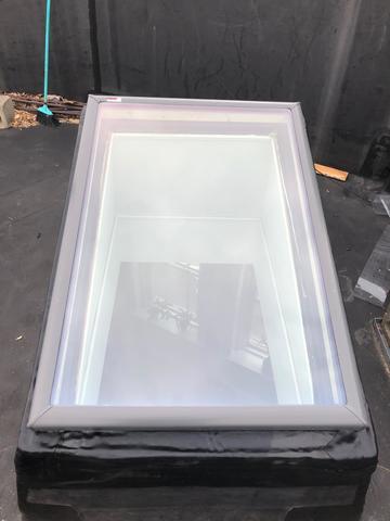Final result of repair of skylight on a flat roof.

