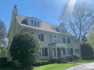 Needham roofing company working on asphalt shingle roof.