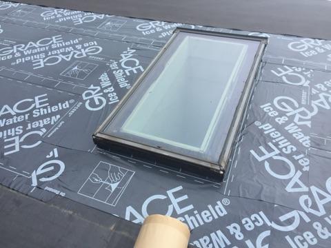 The area directly around the skylight has been fitted with ice & water shield for extra protection, and the rubber membrane can be seen as well.