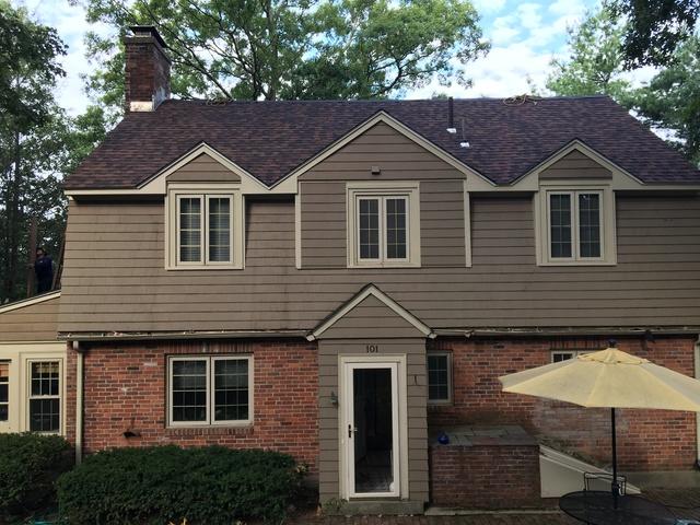 Our crew has completed the job, as you can see through the new shingles and the carpentry work around the dormers.