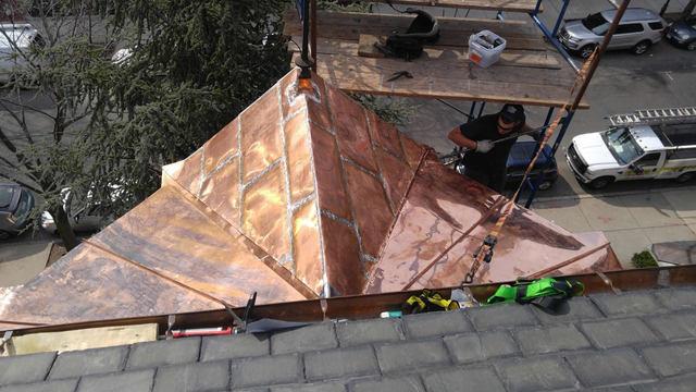 This overhead shot gives you the best view of the new copper roof. You can see how Brian & Dan tied together every panel to create a watertight roof, especially right over the peak of the dormer.