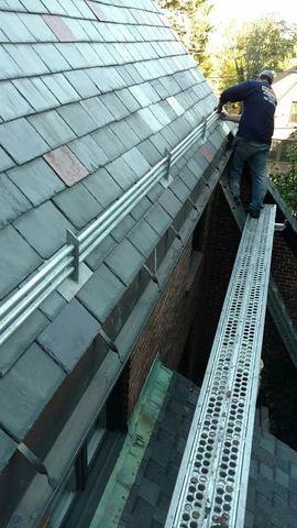 Our crew is finishing up with the last few slates, and the new ice rail will prevent damage from ice dams in the future.