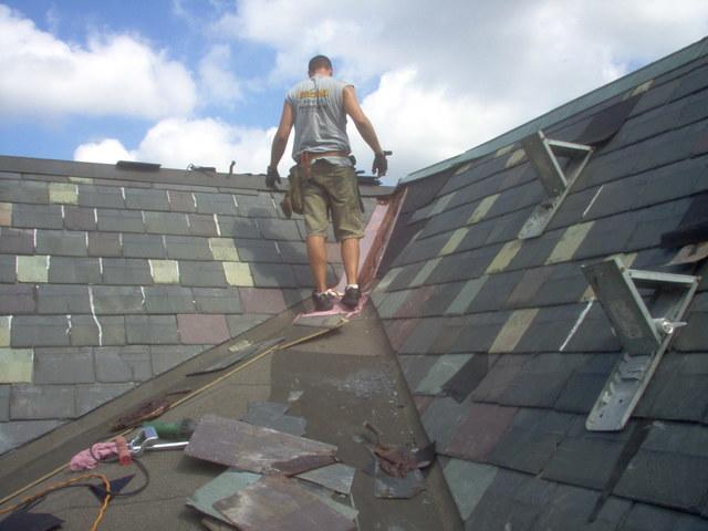 Our crew installs copper near the peak of the roof, as this will tie the existing slates into the new section of the roof. It will also ensure that water is able to run down the roof rather than into it.
