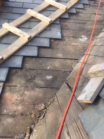 The slates and underlayments have been removed from the valley, setting our crew up to start installing the copper.