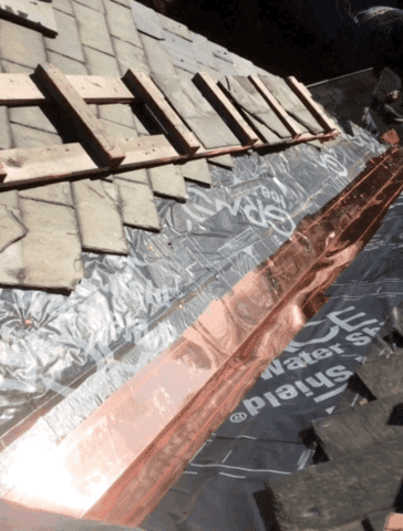 The copper has been installed along the valley, leaving replacing the slates as the last part of this project.