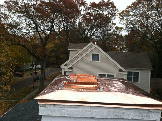 Our crew solders in the copper flues, making a seamless seal between the flues and the rest of the copper chimney cap.