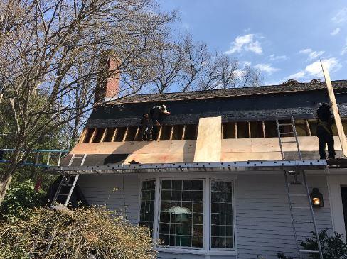 Our crew quickly got the old roof removed so we could begin installing the new shingles. The first step is replacing the old wood which had been damaged by water leaking in.