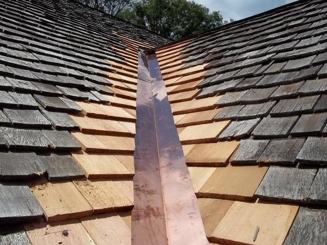 Wood shingle roof and copper valley.
