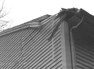 Damaged roof caused by weather. Fixed by roofing.