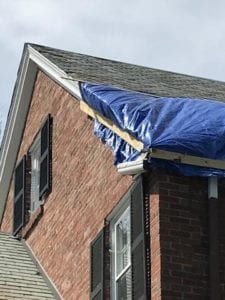 Storm damage causing a need for a roof replacement.