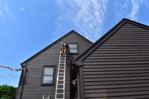 Roofing company installing replacement windows in Newton, MA