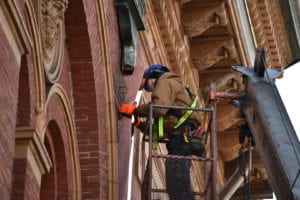 Roofing Contractor working on Historical Restoration.