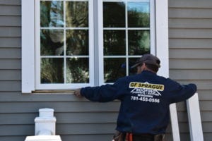 Team Member Installing Window