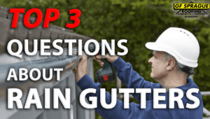"Top 3 Questions about Rain Gutters" over a roofing contractor installing rain gutters into a roof.