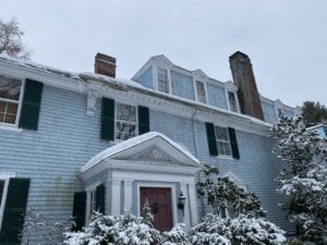 Asphalt shingle roof with snow on top of it.